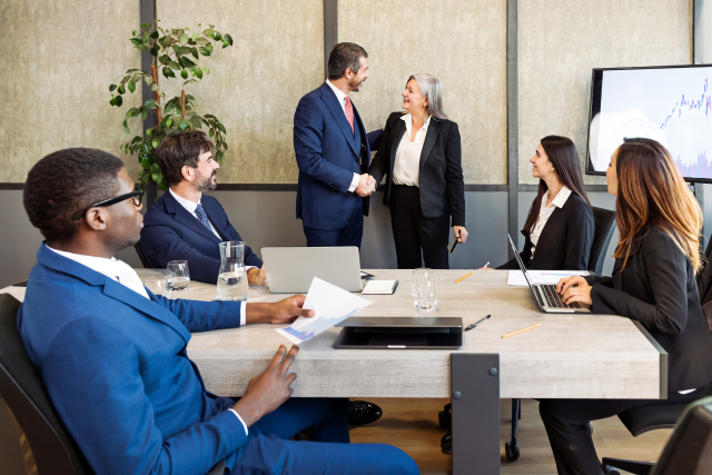 Business team meeting discussing employee wellbeing and EAP strategies in the workplace