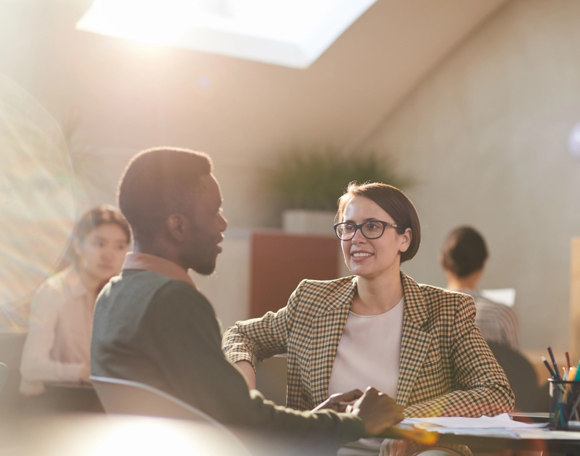 Manager listening supportively to a colleague during a workplace conversation